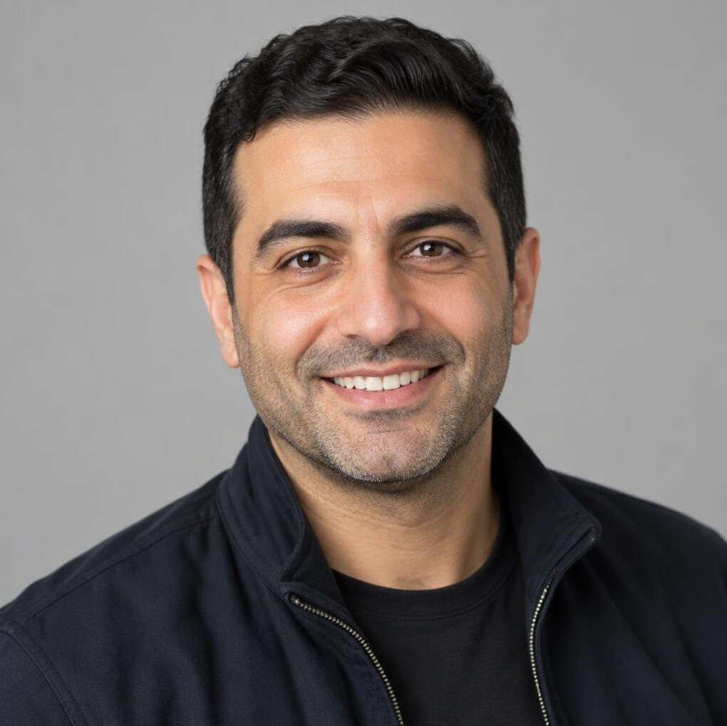 Studio portrait of a smiling middle eastern man