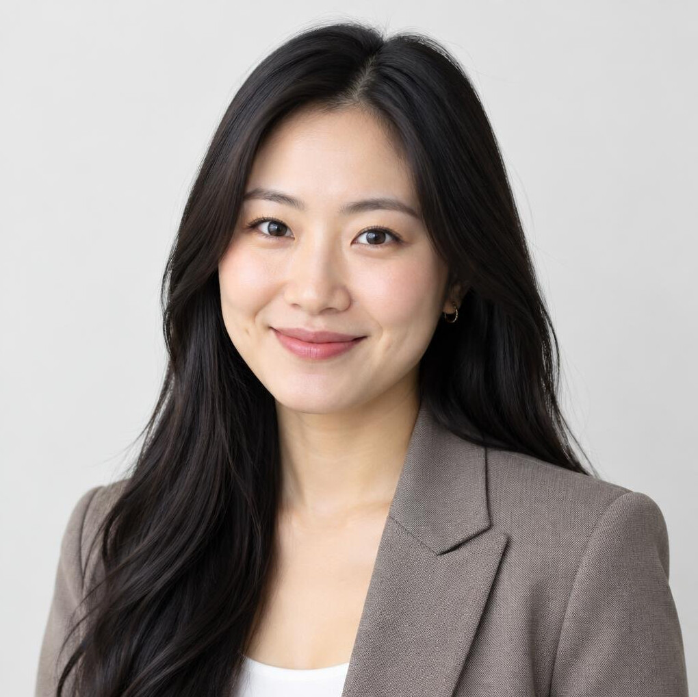Studio portrait of a smiling asian woman with long dark hair